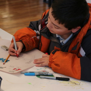 A boy drawing at Comic Book in a Day 2015